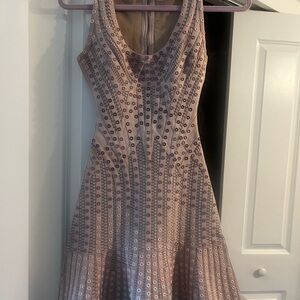 Original Herve Leger designer dress size XS
Tan with pink tan and white grommet